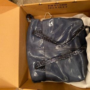 Designer bag, small stain on inside includes box and dust bag